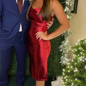 red knee length dress with a slit on one side. Adjustable straps, only worn once